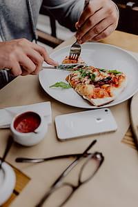 Eating delicious pizza in a cozy restaurant thumbnail