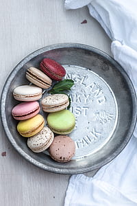 round gray steel plate with multicolored macaroons thumbnail