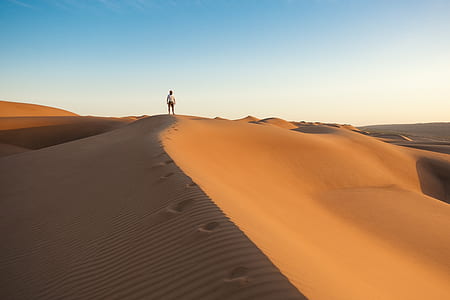 man standing on desert thumbnail