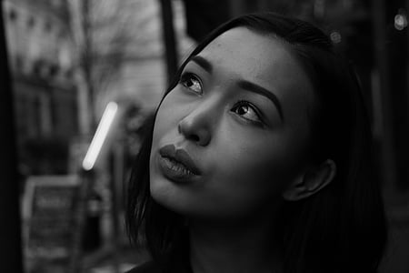 grayscale photo of a woman looking up thumbnail