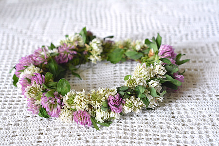 purple and white petaled flowers headdress on white crochet textile thumbnail