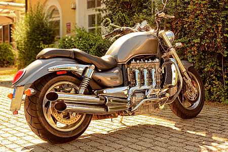 cruiser motorcycle park near house thumbnail