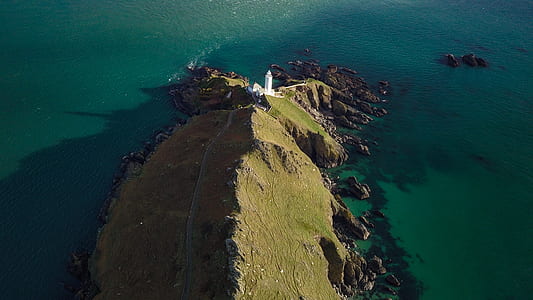 aerial view of island near body of water thumbnail