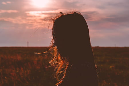 silhouette of woman facing left during golden hour thumbnail