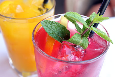 clear drinking glass with red liquid with black straw thumbnail