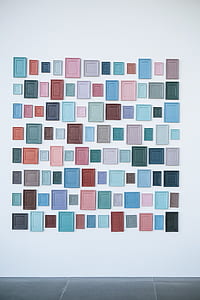 assorted-color photo frame lot on white wall paint thumbnail