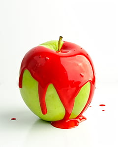 granny smith apple with red paint thumbnail