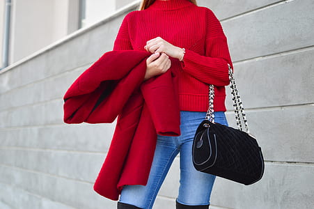 woman carrying black shoulder bag thumbnail