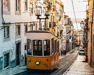 yellow and white train during daytime photo thumbnail