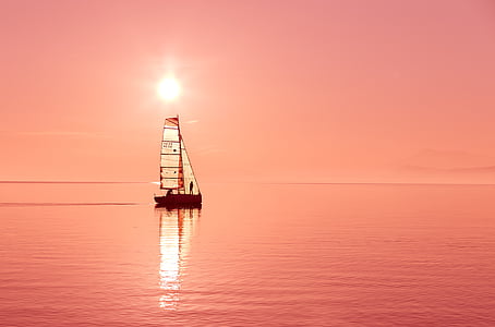 photo of sail boat during golden hour thumbnail