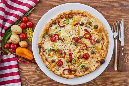 pizza on round white ceramic plate thumbnail