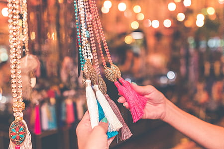 person holding tassel accessory thumbnail