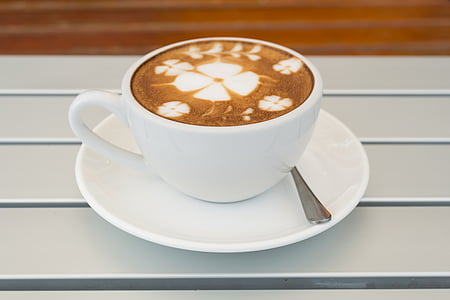 white teacup set on white wooden thumbnail