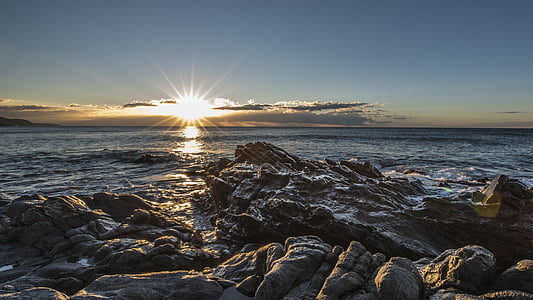 rock formation near sea during daytime thumbnail