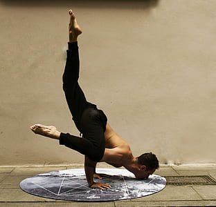 man doing hand stand on floor thumbnail