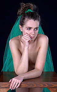 woman wearing green veil thumbnail