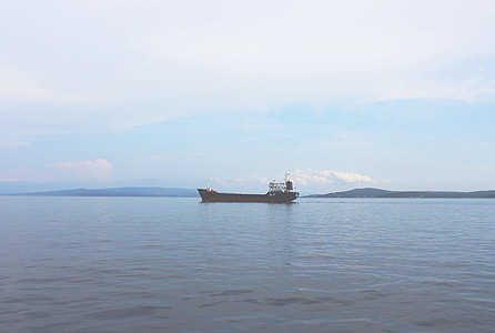 black and white ship in the middle of the sea thumbnail