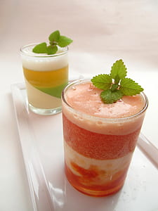 two cocktail drink-filled glasses on tray thumbnail