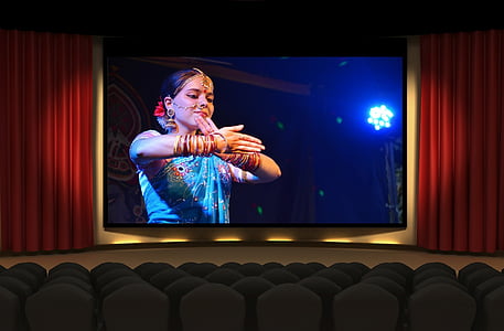 theater showing woman wearing blue dress thumbnail