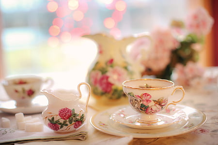 selective focus photography of white and pink floral ceramic cup and saucer thumbnail
