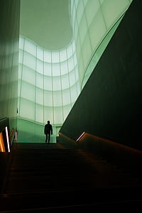 person walking on stair in building thumbnail
