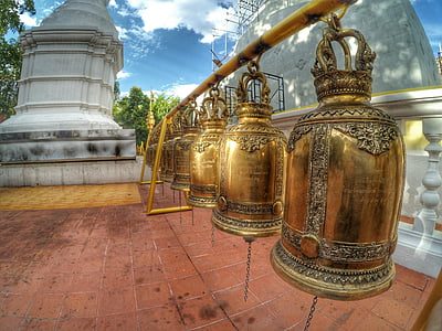 brass bell lot during daytime thumbnail