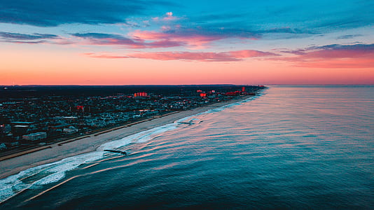 bird's eye view of beach near city buildings thumbnail