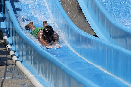 boy going down on water slide head first thumbnail