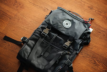 black backpack on floor thumbnail