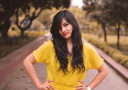 woman wearing yellow top on park thumbnail