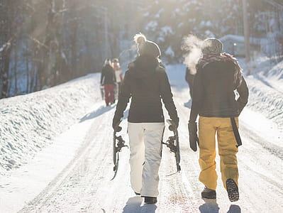 woman wearing black coat beside man during daytime thumbnail