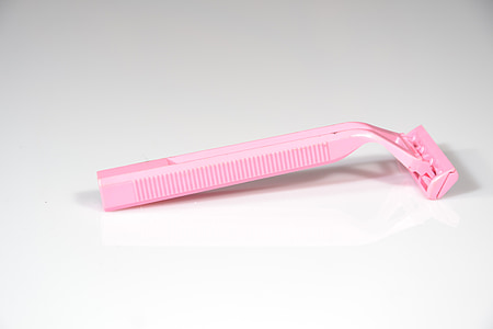 pink shaver on white surface thumbnail