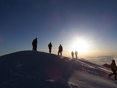 silhouette of group of people on top of mountain thumbnail