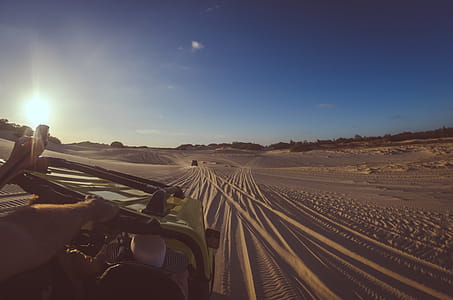 Person Riding Yellow Dune Buggy thumbnail