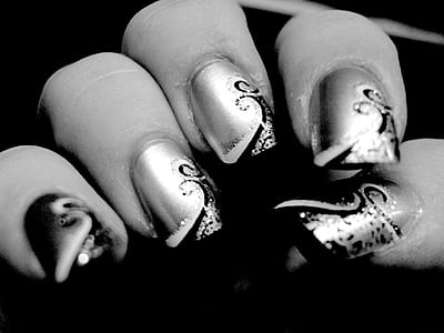 grayscale photography of nail polish thumbnail