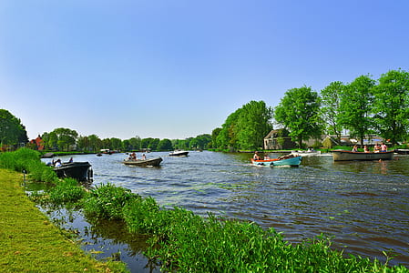 four boats on body of water thumbnail