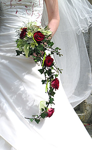 woman holding bouquet of red roses thumbnail