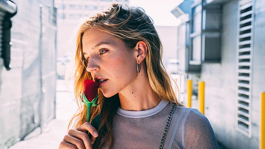 woman holding rose thumbnail