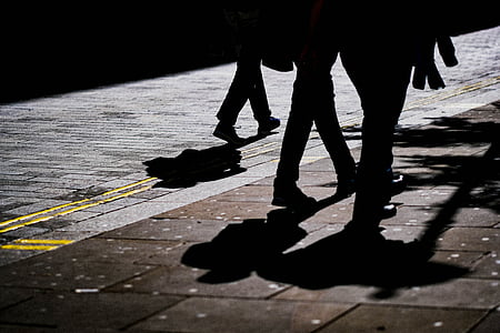 three people walking on street thumbnail