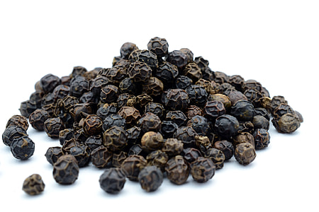 black peppers on white surface thumbnail
