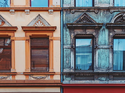 two brown and black concrete buildings thumbnail