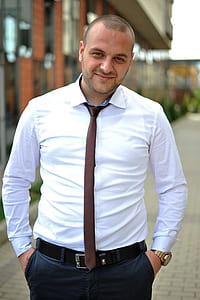 man wearing white dress shirt and brown necktie thumbnail