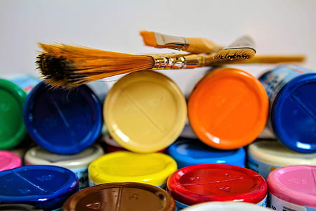 photography of paint brush on cans thumbnail