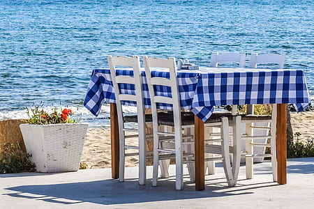 blue and white plaid table cloth on brown wooden table thumbnail