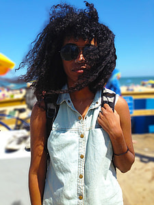 man in gray washed button-up sleeveless top, backpack, and sunglasses during daytime thumbnail