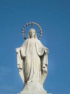 female concrete statue during daytime thumbnail