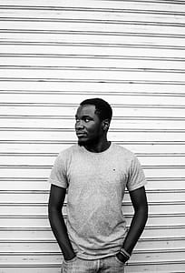 Grayscale Photo of Man Standing thumbnail
