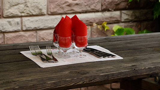 four stainless steel forks and clear footed drinking glasses thumbnail