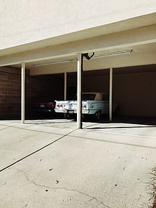 white car parked inside the garage thumbnail