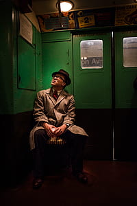 man looking up sitting on chair thumbnail